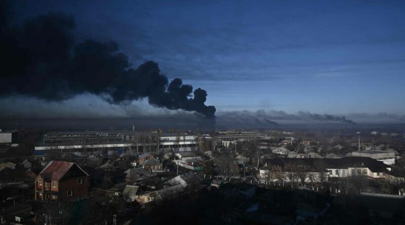 97754916 TOPSHOTBlack smoke rises from a military airport in Chuguyev near Kharkivon Februa